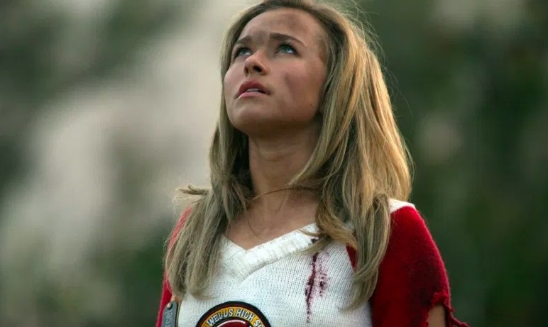 Heroes still: Claire looks up, her face dirty, wearing a bloody and torn cheerleading uniform