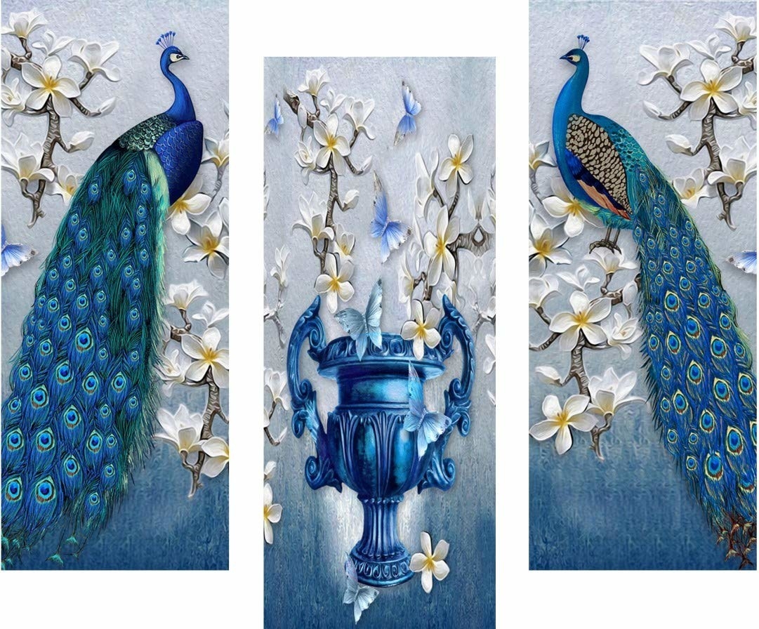 A set of three paintings with peacocks on either sides and a fountain in the middle.