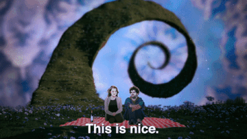 Gif from Can&#x27;t Touch This with couple having picnic in psychedelic land