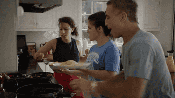 Ilana and Abbi from &quot;Broad City&quot; making eggs and pancakes in a kitchen