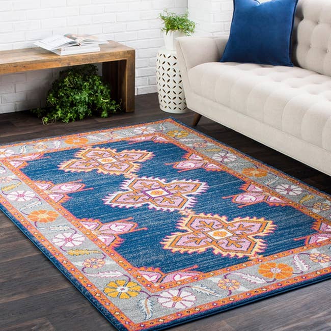 blue, great, pink and yellow floral and geometric patterned rug