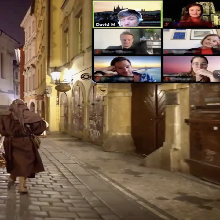 A screenshot of a Zoom call with the plague doctor walking down cobblestoned streets at night and the screens of other guests in the top right corner