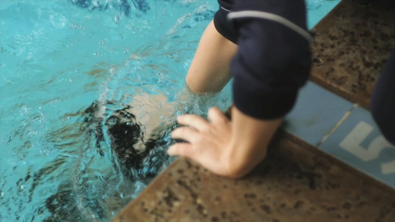 Paige shoves Emily under the pool water