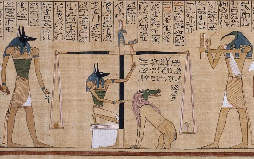 A page from the Egyptian Book of the Dead with hieroglyphics and drawings