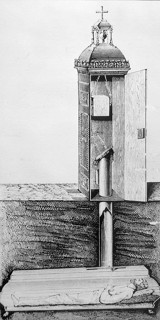 A drawing of a coffin underground with a tube leading above ground so the person inside it, if buried alive, could breathe and call for help