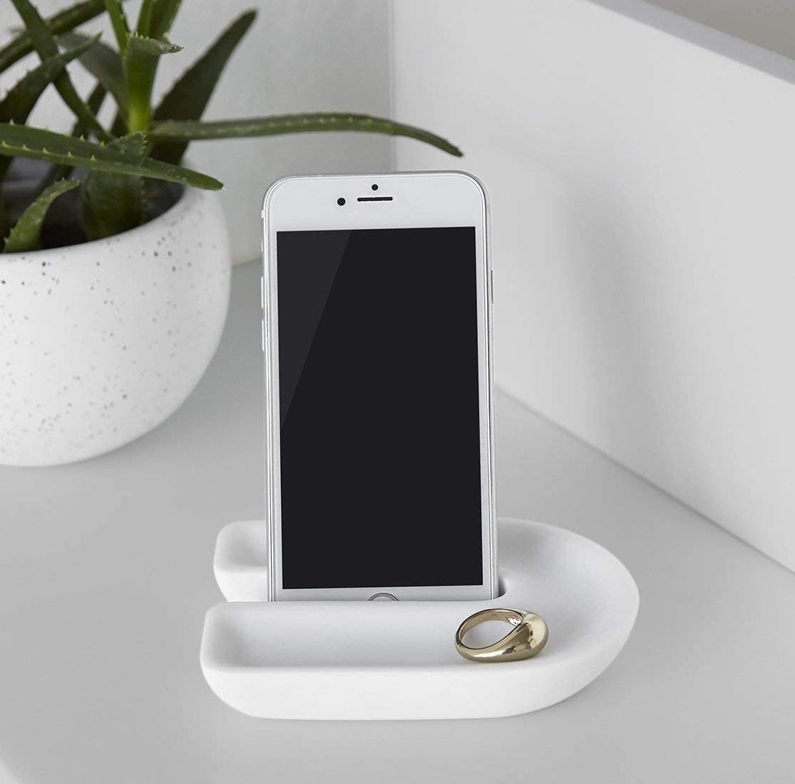 the white countertop tray with an iPhone and ring inside