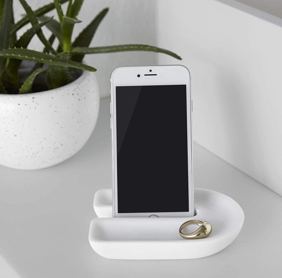 the white countertop tray with an iPhone and ring inside