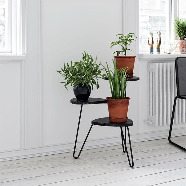 Three tiered black plant stand with connected, rounded wire legs