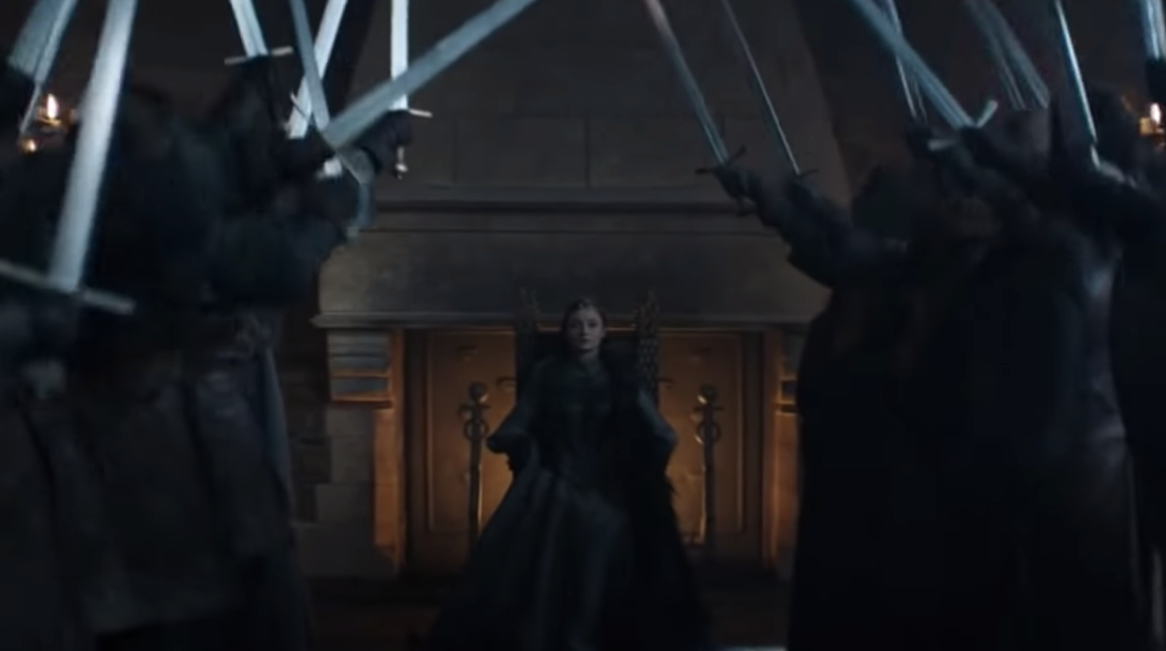 Sansa sitting on the throne as people lift their swords in to say, &quot;The Queen of the North!&quot; 