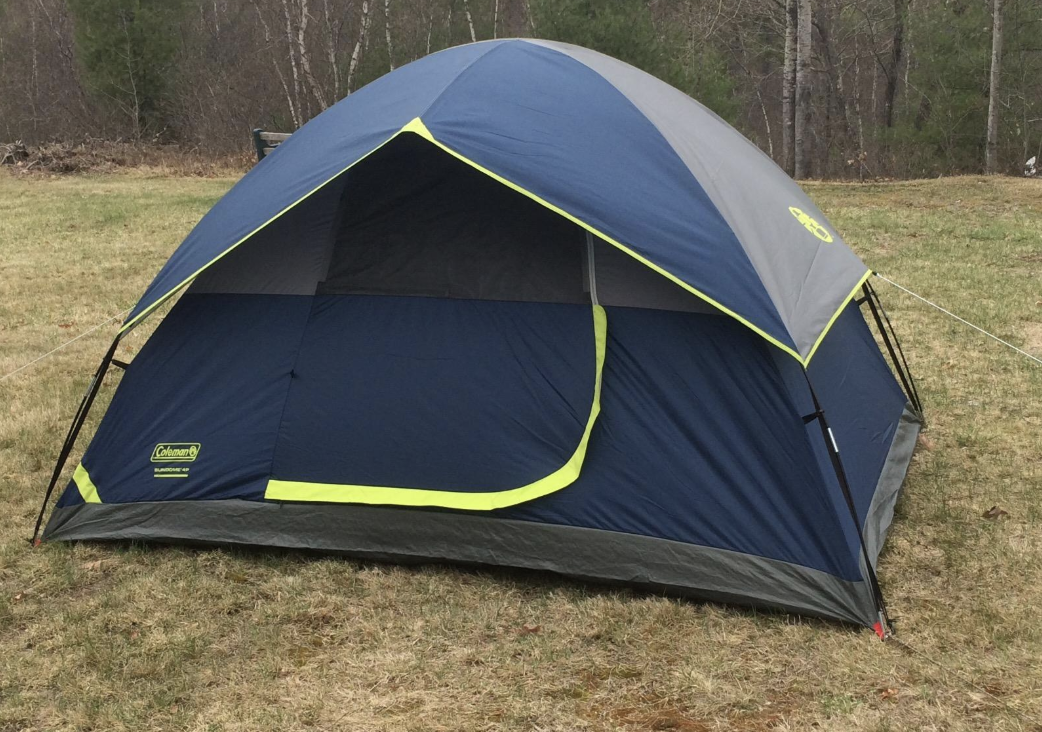 navy blue tent pitched outside 