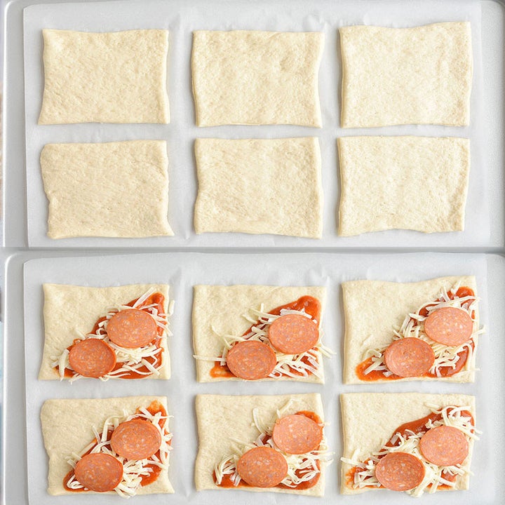 A process shot of making the pizza pockets, topping store bought pizza dough with tomato sauce, pepperoni, and cheese. 