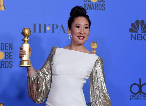 Sandra Oh holding her Golden Globe for "Outstanding Actress in a TV Series, Drama" for her work on "Killing Eve"