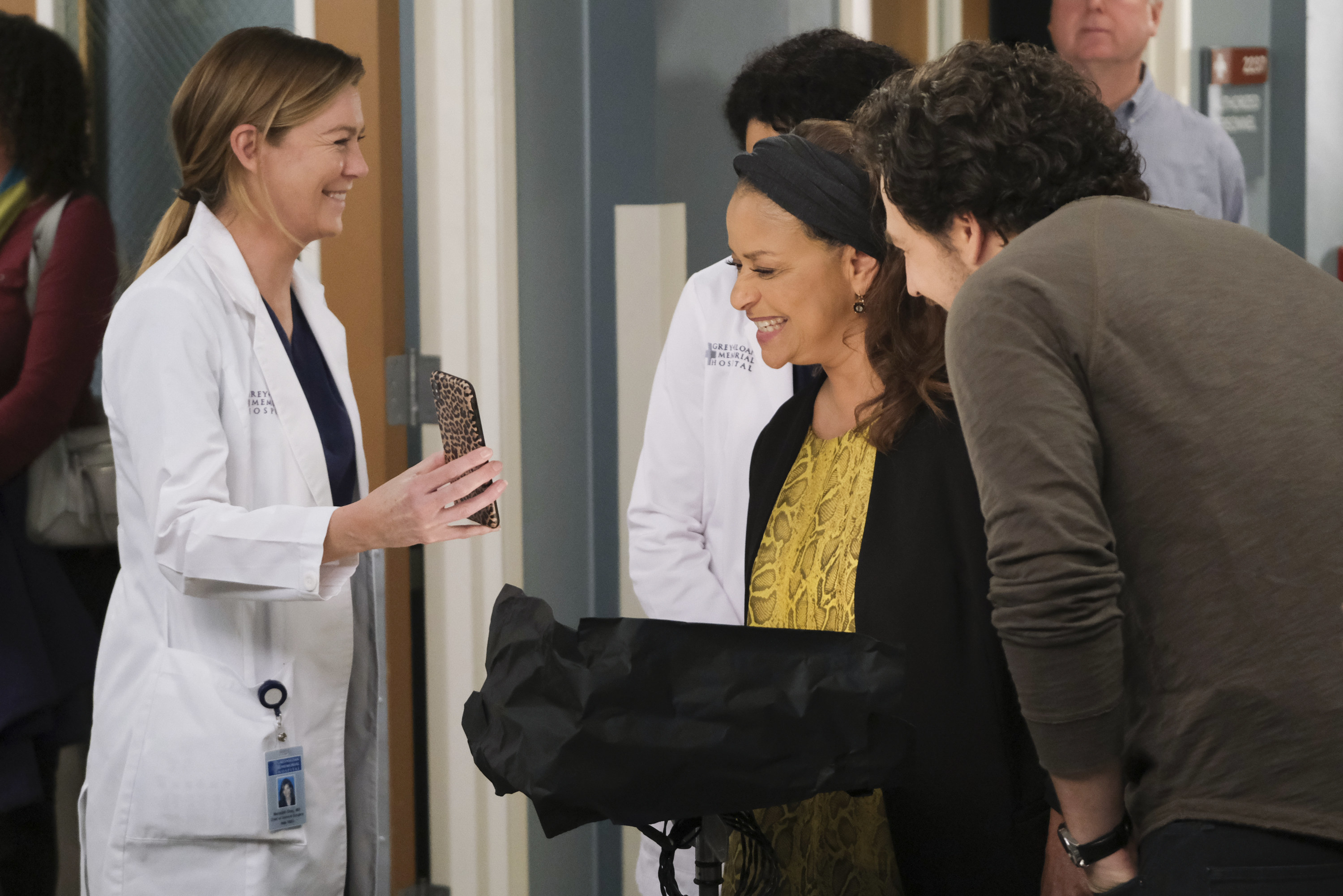 Ellen Pompeo showing Debbie Allen something on her phone behind the scenes of &quot;Grey&#x27;s Anatomy&quot; Season 16