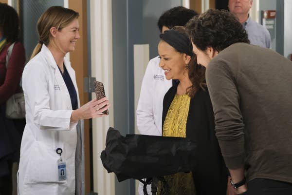 Ellen Pompeo showing Debbie Allen something on her phone behind the scenes of "Grey's Anatomy" Season 16