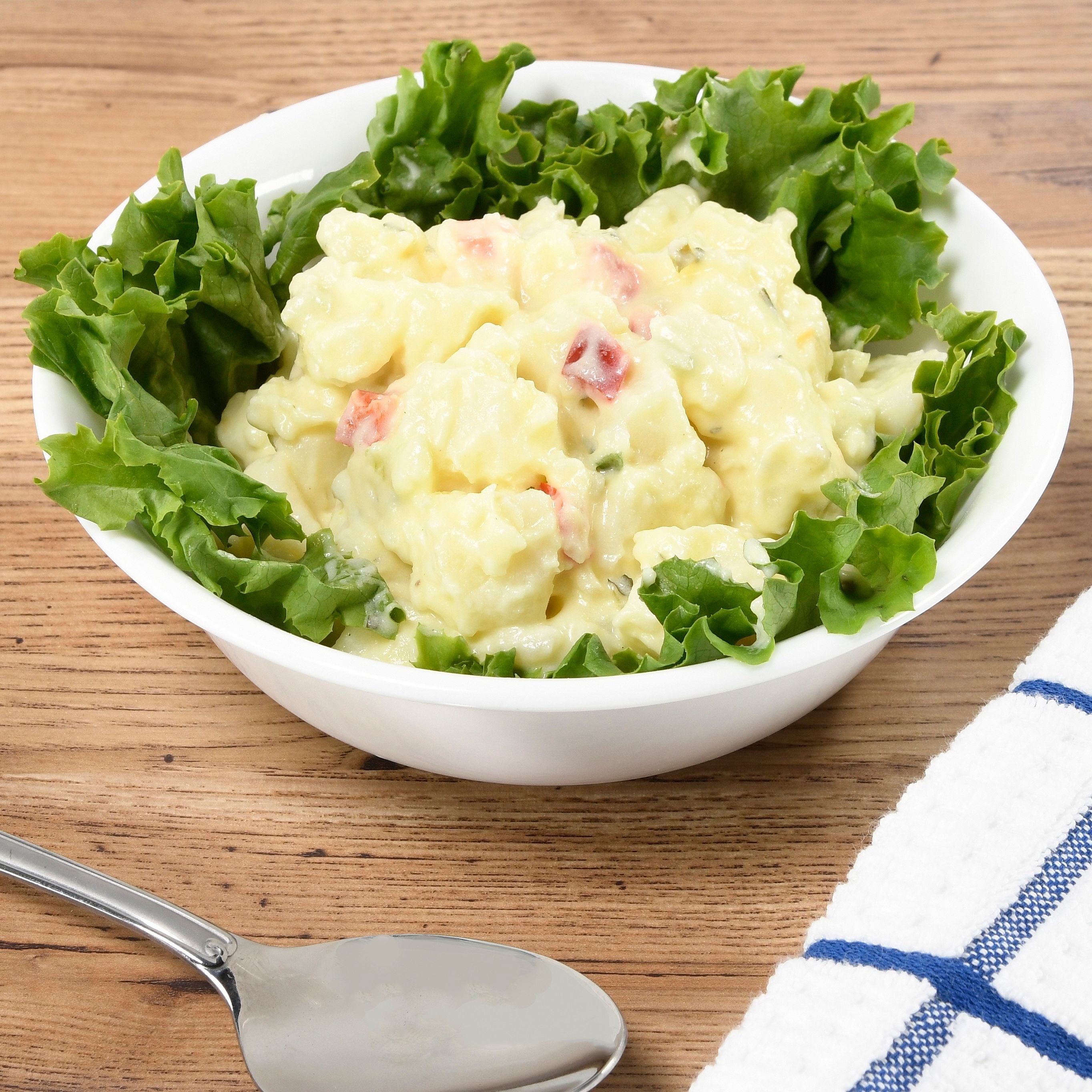 A bowl of the potato salad on a table