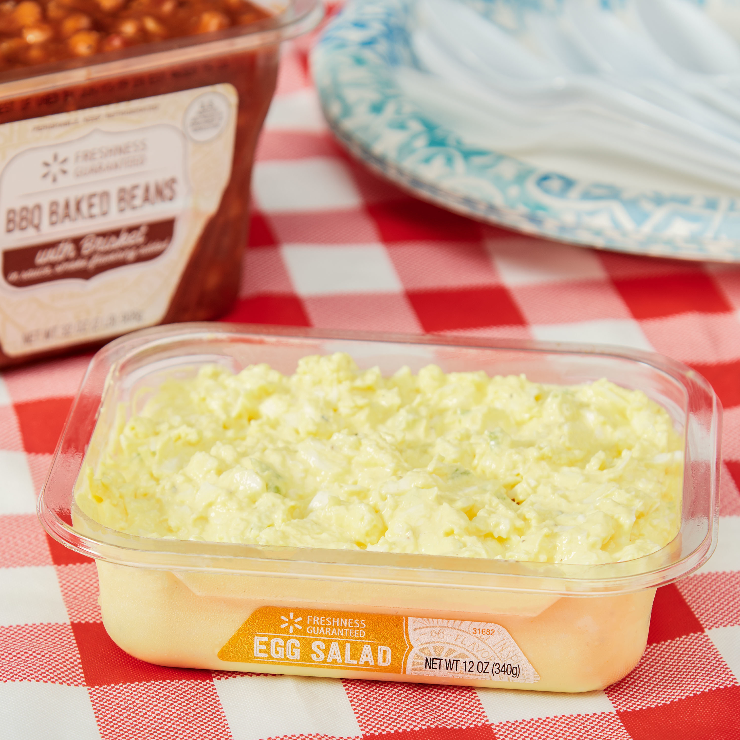 The container of egg salad on a table