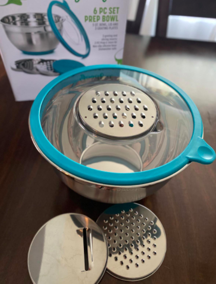 Reviewer&#x27;s silver and light blue mixing bowl with three interchangeable graters 