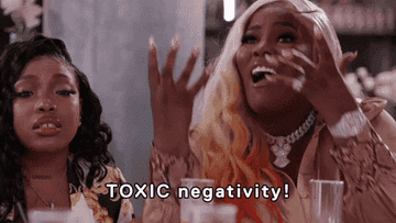 A GIF of a woman emphasizing the words &quot;toxic negativity&quot;