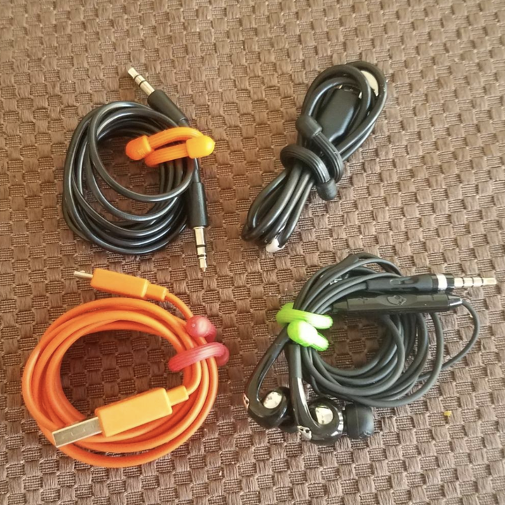 four charging cables secured with rubber twist ties 