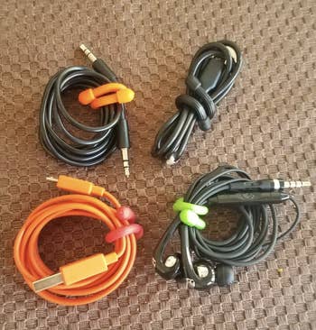 four charging cables secured with rubber twist ties 