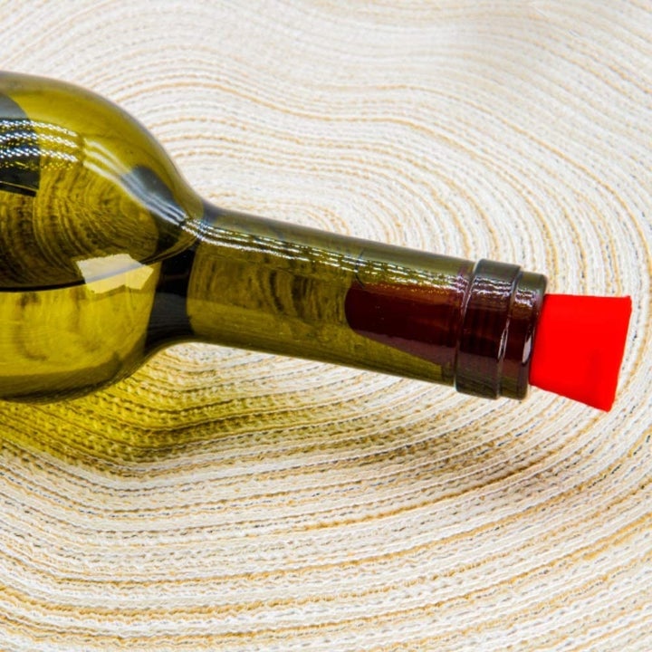 A bottle with a stopper in it