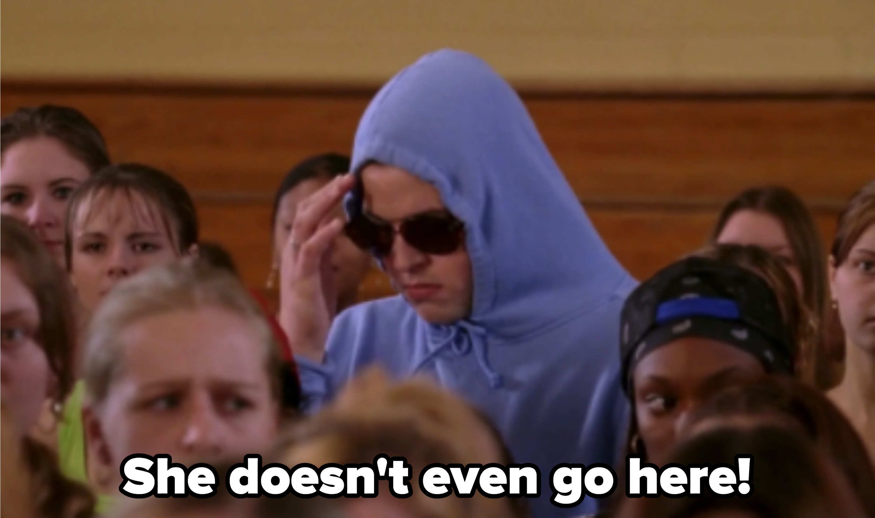 Damian from &quot;Mean Girls&quot; hiding in a hoodie at the girls&#x27; assembly, screaming: &quot;She doesn&#x27;t even go here!&quot;