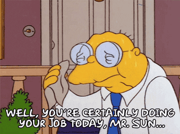 Hans Moleman from The Simpsons looking at the sun, commenting on how hot it is. The sun then reflects off his glasses, resulting in him catching on fire.