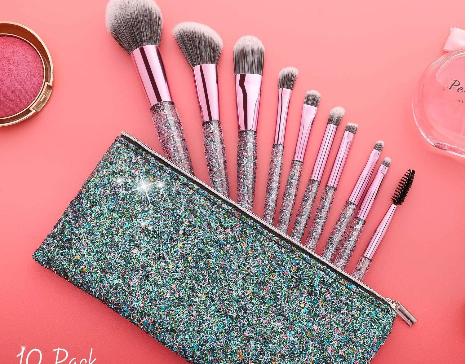 Nine makeup brushes with sparkly handles in a sparkly makeup bag