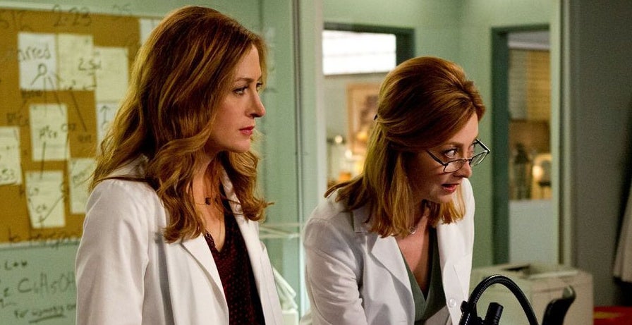 Dr. Isles and Hope looking at a computer screen in &quot;Rizzoli &amp; Isles.&quot; 