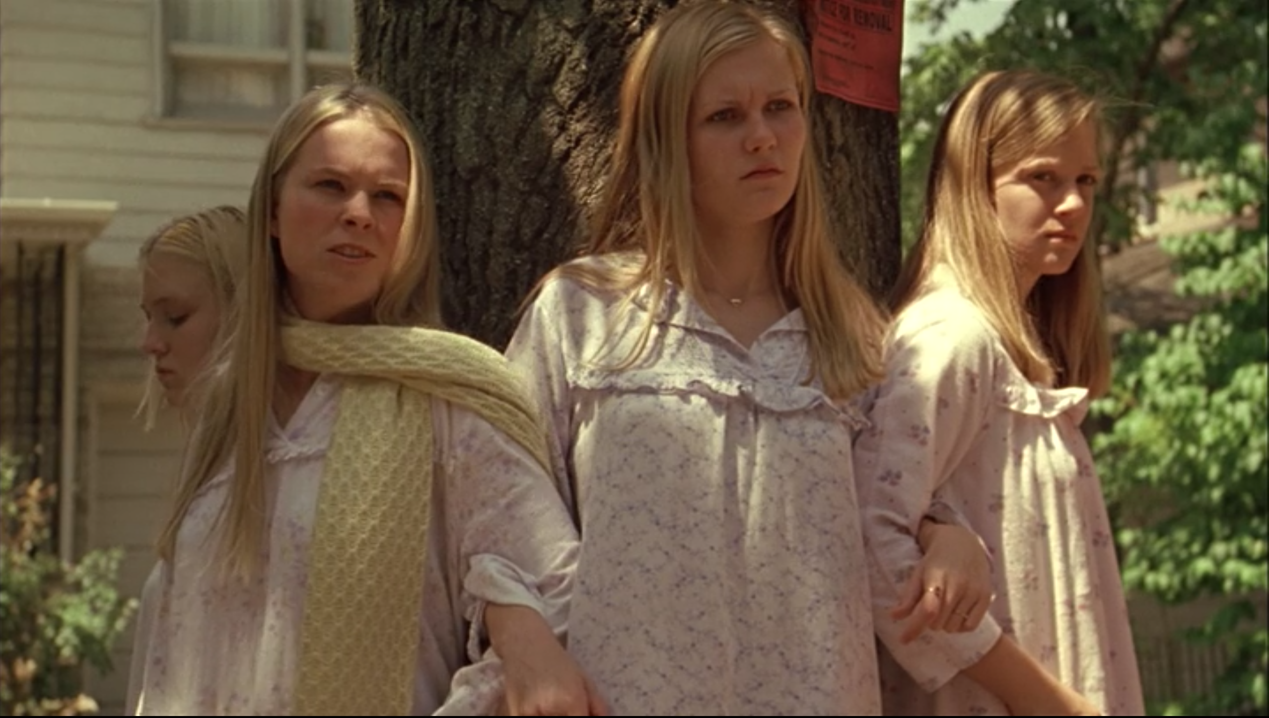 The Lisbon sisters, linked arm-in-arm, around a tree in &quot;The Virgin Suicides.&quot; 