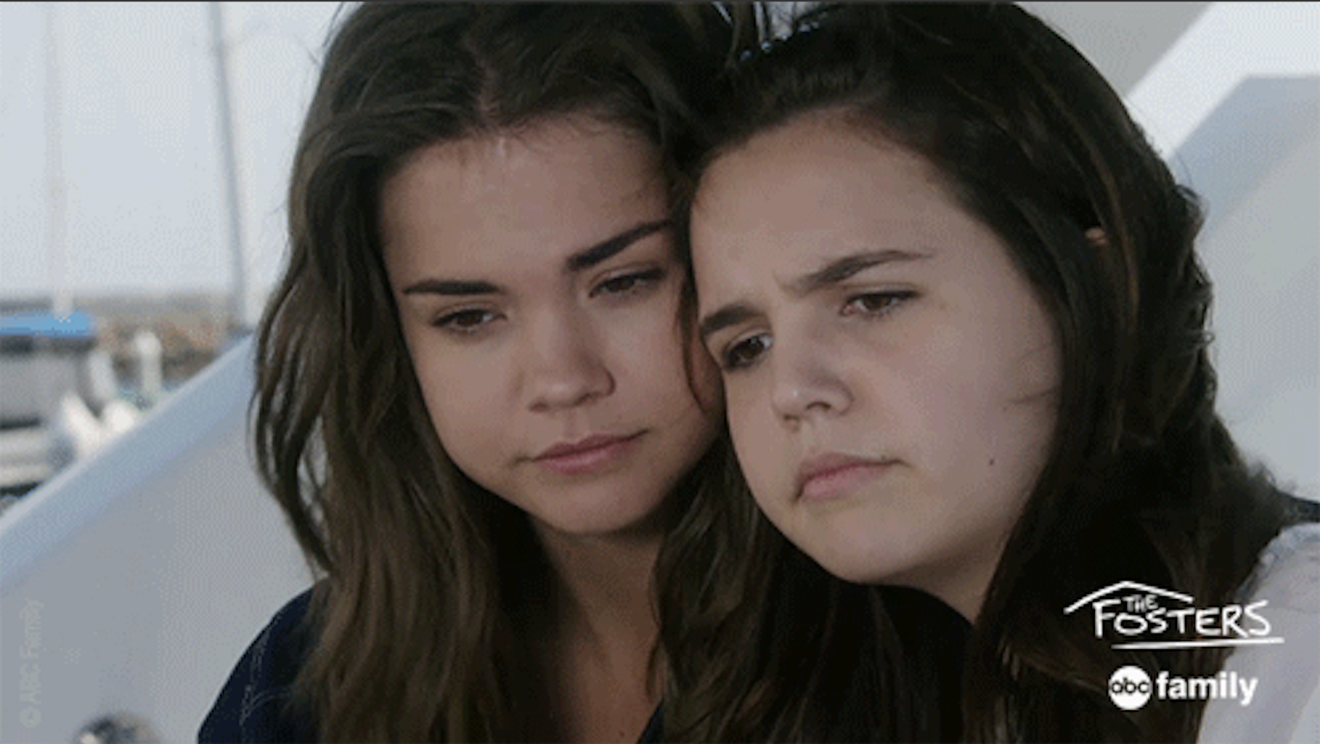 Callie and Sophie cuddled next to one another, cheek-to-cheek, in &quot;The Fosters.&quot; 