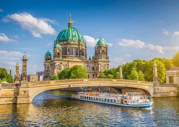 A river and bridge with a view of the Berlin Cathedral behind