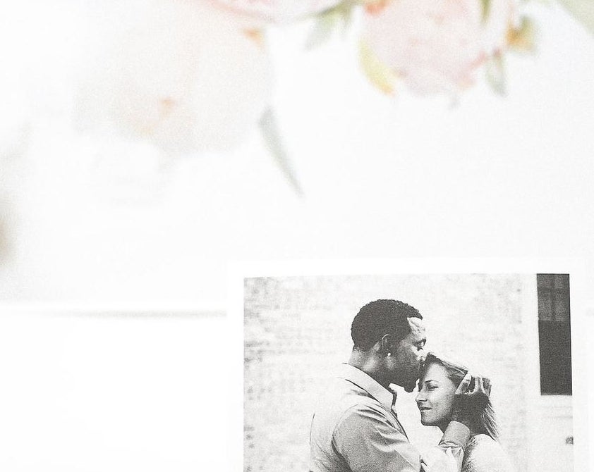 pink block holding up a black and white photo 