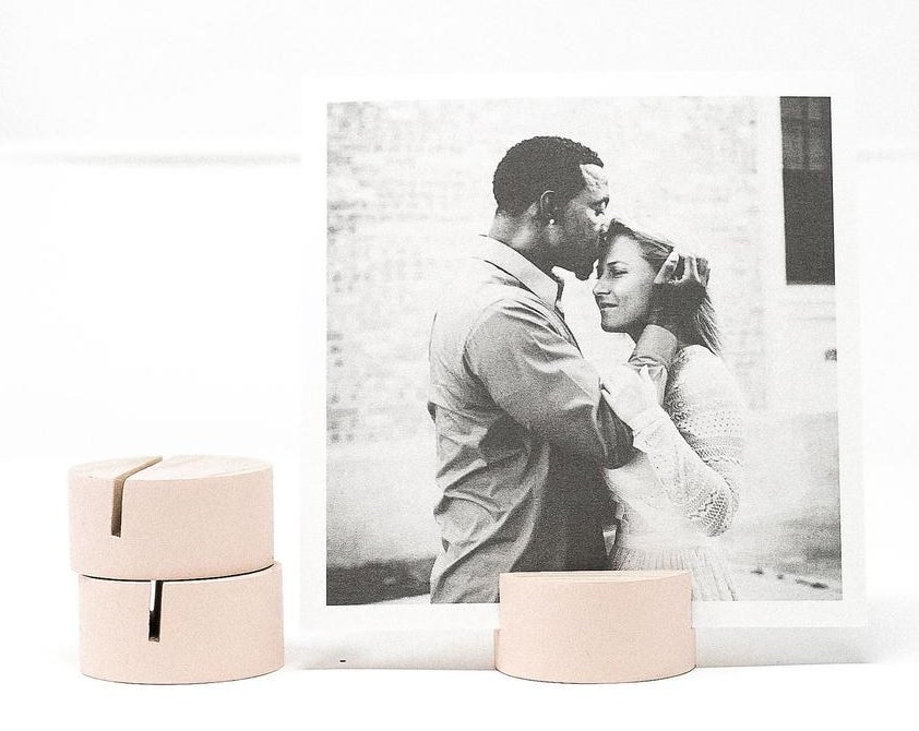 pink block holding up a black and white photo