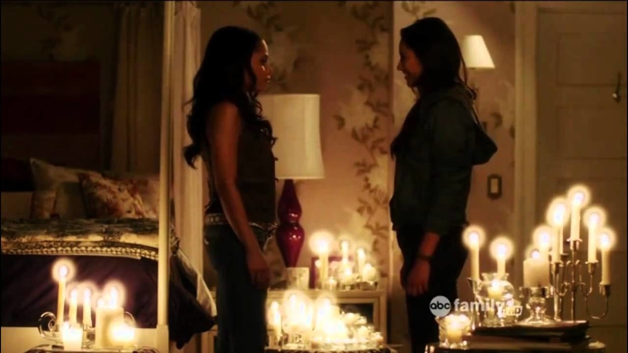 Emily and Maya in Spencer&#x27;s room with a bunch of candles