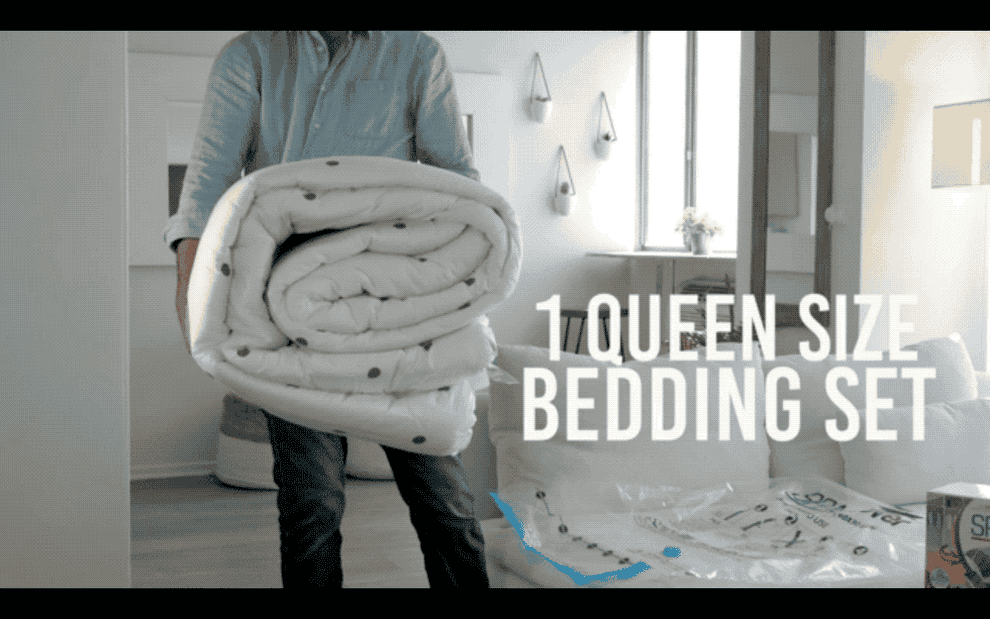 A gif of a queen size bedding set being stored and vacuumed to reduce the size