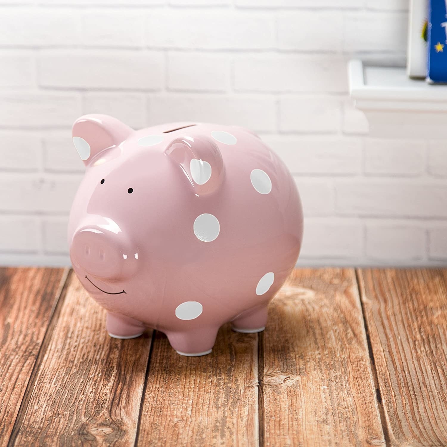The pink piggy bank with a slot on top for adding money