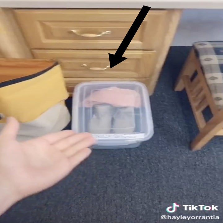 A plastic bin for costume shoes and socks.