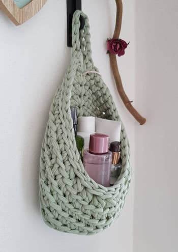 The knit hanging basket filled with personal care goods 