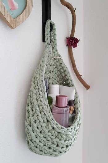 The knit hanging basket filled with personal care goods 