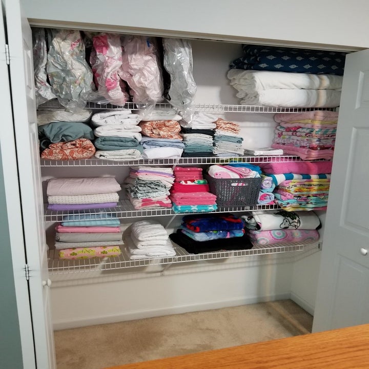 The same closet, with everything folded neatly, and some in vacuum bags, with way more stuff