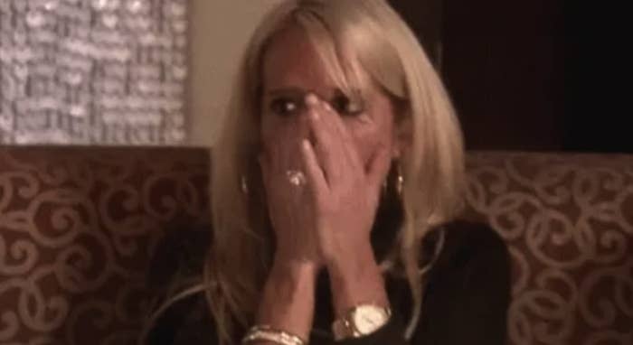 Random woman who's covering her mouth in shock