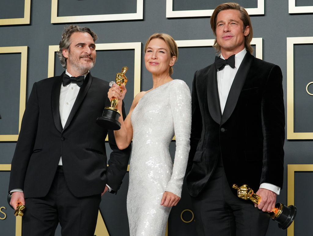 Brad Pitt, Renee Zellweger, and Joaquin Phoenix stand with their Oscars