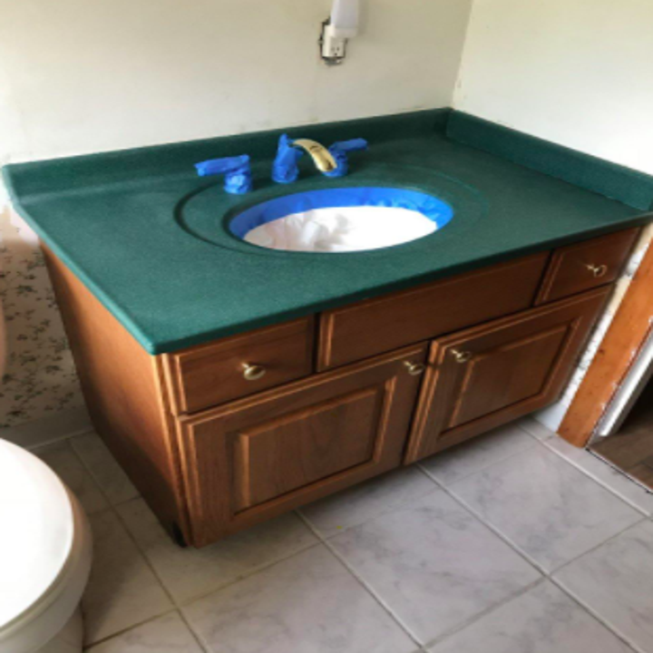 reviewer pic of ugly green bathroom vanity top 