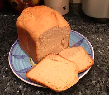 A reviewer photo of a sliced load of bread on a plate 
