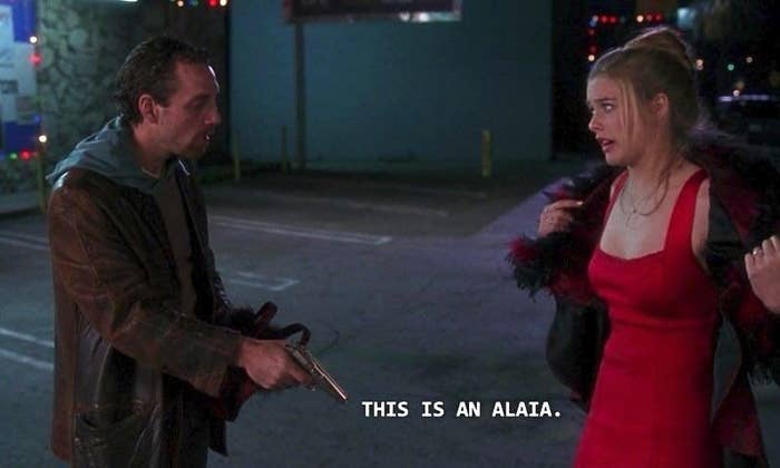 A screenshot of from &quot;Clueless&quot; of the scene where Cher is being mugged while wearing a red dress and says &quot;this is an Alaïa&quot;
