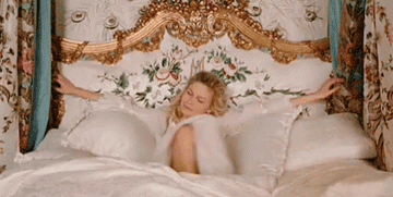 Kirsten Dunst in &quot;Marie Antoinette&quot; relaxing in a big royal bed