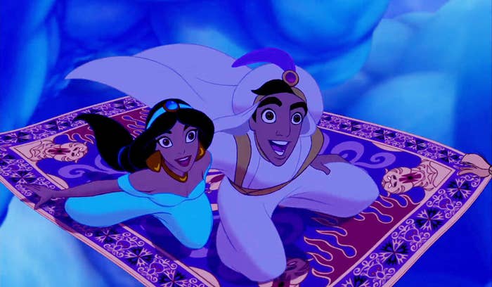 A screenshot of Princess Jasmine and Aladdin (as Prince Ali) flying on carpet through the sky during the "A Whole New World" scene