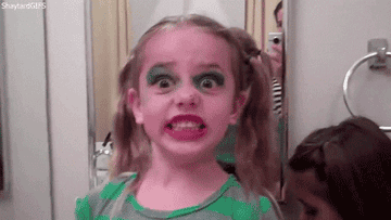 a young girl is shocked upon discovering how horrible her makeup looks