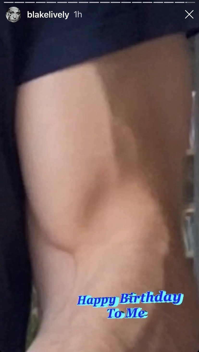 A zoomed-in version of the cake photo, zoomed in on Ryan&#x27;s muscular bicep holding the cake